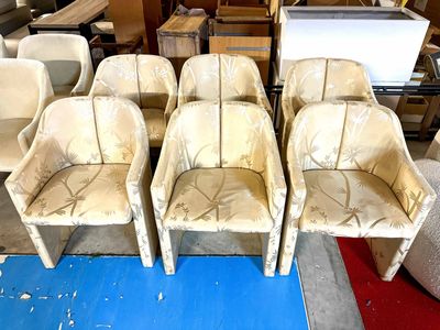 four chairs that are sitting in the middle of a room