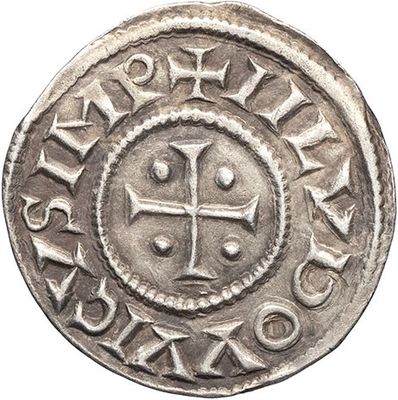 a silver coin with a cross in the center of it