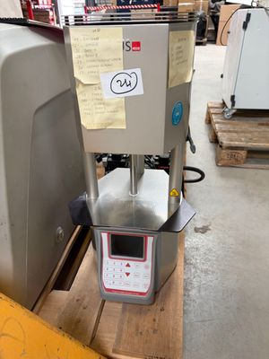 a machine that is sitting on a pallet in a warehouse