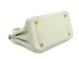 the white purse is open and ready to be used