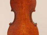 an antique violin with a wooden back and bow on a white background