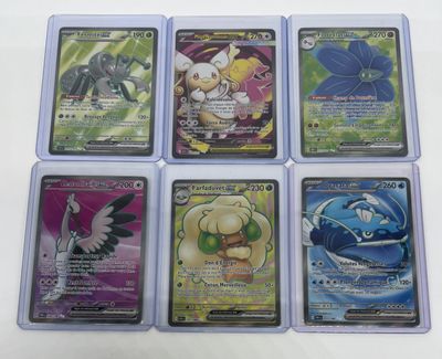 six different pokemon cards are shown in a row on a table