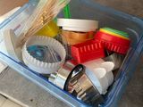 a plastic container filled with cleaning supplies on the counter