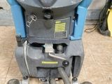 a machine that is sitting on the floor in the room