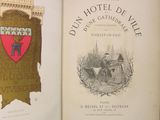 an open book with a picture of a man on a horse and a coat of arms on it