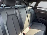the back seats of a car with a seat belt in the back of it