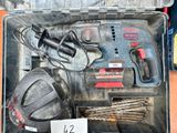 a tool box with a hammer, drill, screwdriver, and other tools in it
