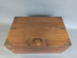a small wooden box with a handle on it