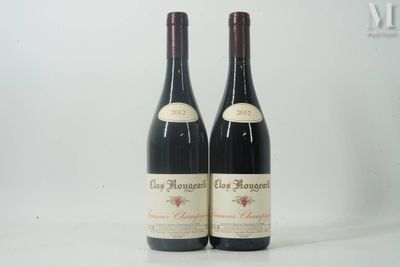 two bottles of red wine sitting next to each other on a table