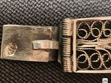 a silver buckle with a ring on it