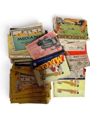 many books stacked on top of each other on a table