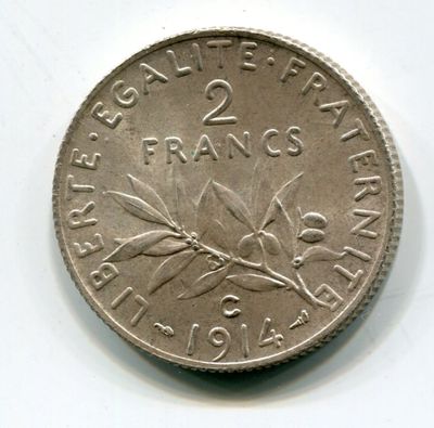 a coin that is sitting on a white surface