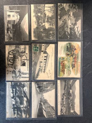 a lot of old postcards that are on the table