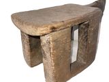 a stone bench that is sitting on a white surface