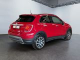 the rear end of a red fiat suv parked in a garage