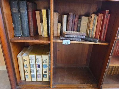 a book shelf with many books on it in a room