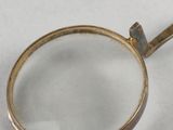 a magnifying glass on a white surface