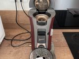 a coffee machine that is sitting on a kitchen counter