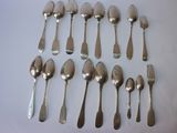 a lot of silver spoons and spoon spoons on a table