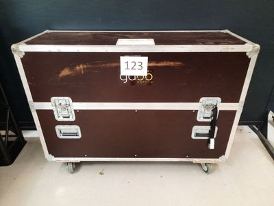 a brown and white trunk sitting on top of a white floor