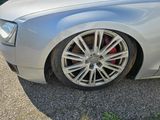 a picture of a silver car parked in a parking lot