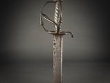 a close up of a sword on a black background