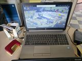 a laptop computer sitting on a desk with a mouse