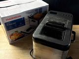 a box of food sitting on a table next to a toaster