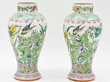 pair of chinese vases decorated with birds and flowers on a white background
