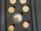 an image of a picture of a set of coins in a box