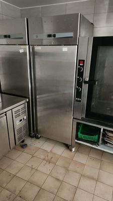 a kitchen with a lot of stainless steel appliances in it