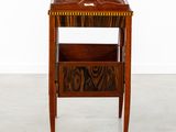 an image of a wooden table with a magazine rack on it