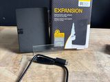 the external hard drive is sitting on a table next to an external hard drive