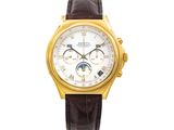 a close up of a gold wrist watch with a white dial