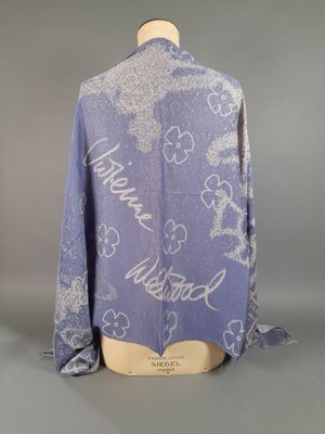 the back of a blue shirt with white flowers on it