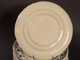 four plates stacked on top of each other on a table
