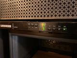 a close up of a black oven with a clock on it