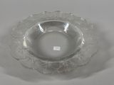 a clear glass bowl with a flower design on it