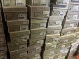many boxes of electronic equipment stacked on top of each other