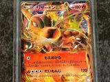 a close up of a pokemon card in a plastic case