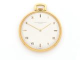 a close up of a gold watch with roman numerals on the face