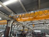 a crane that is hanging from the ceiling of a building