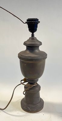 a lamp that is sitting on a table with a cord