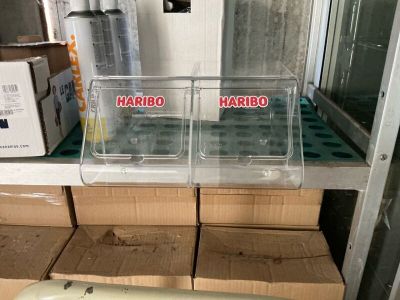two boxes of hard boiled eggs sitting on a shelf