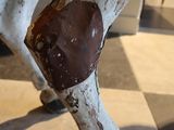 a statue of a horse with a heart on it ' s leg