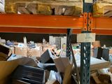 a pile of computer equipment sitting in a warehouse