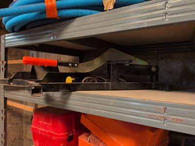 a shelf with many different types of hoses on it
