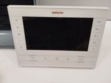 a microwave sitting on a table next to a microwave oven