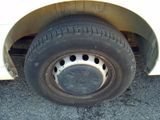 a close up of a tire on the side of a car