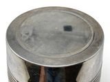 a silver container with a lid on a white surface